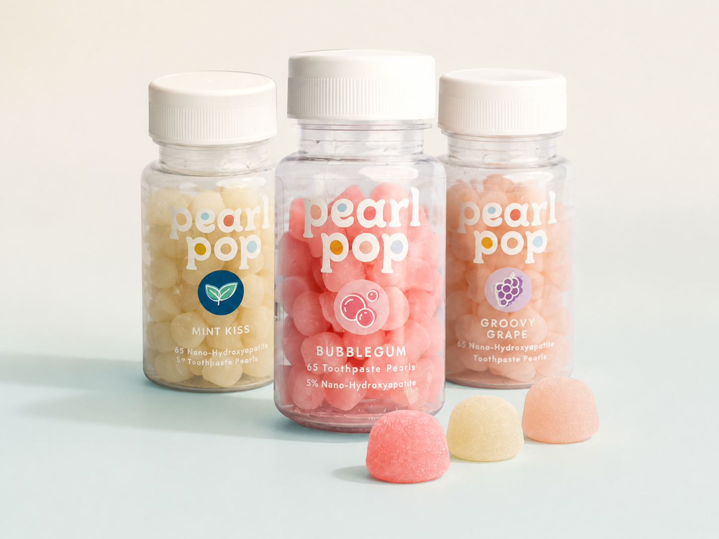 Pearl Pop toothpaste pearl bottles in a clean product still life